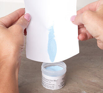 Enamel being poured into jar